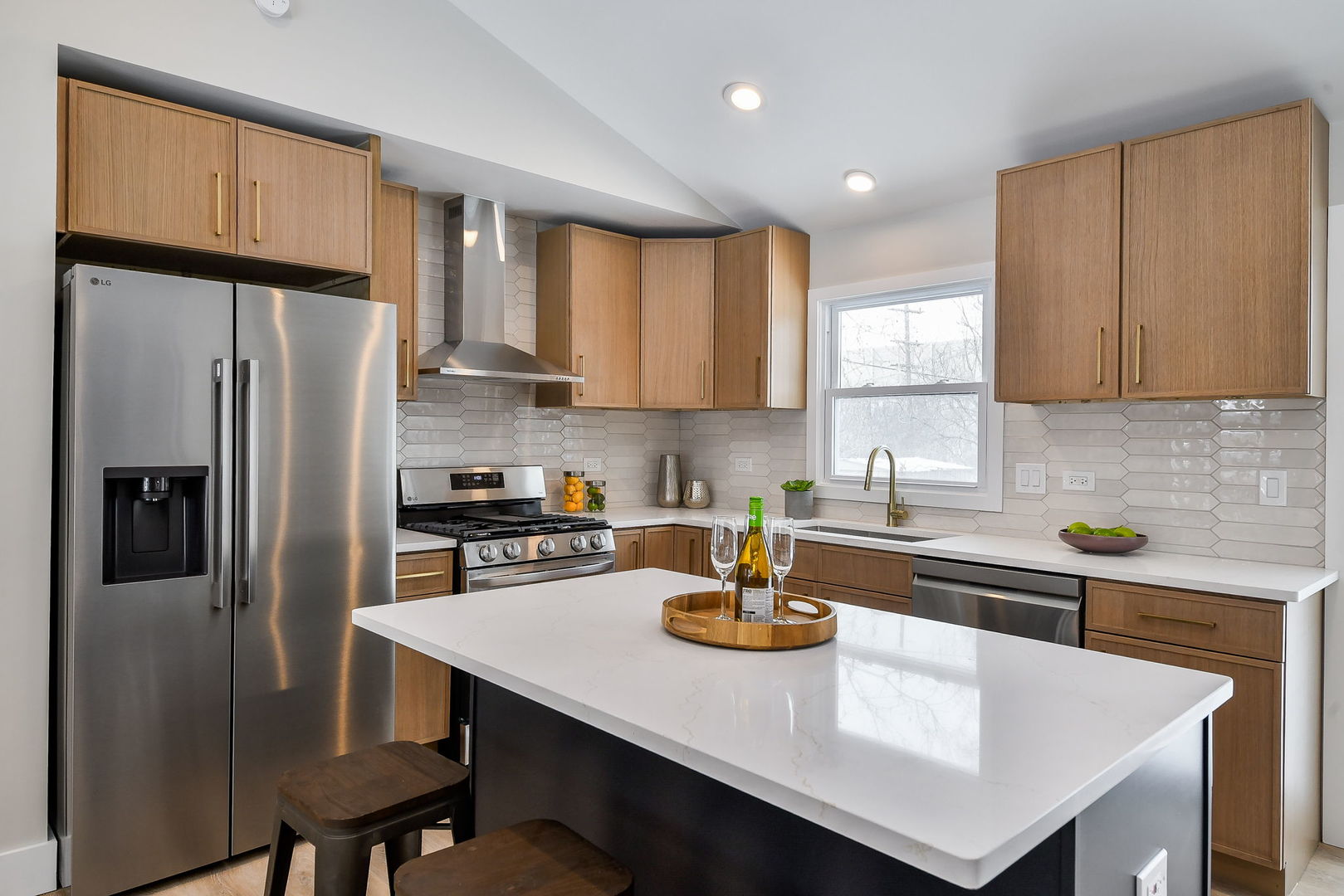 5740 Ridgewood Drive Western Springs, IL 60558 - Photo 12 of 25 a kitchen with a sink a refrigerator and cabinets
