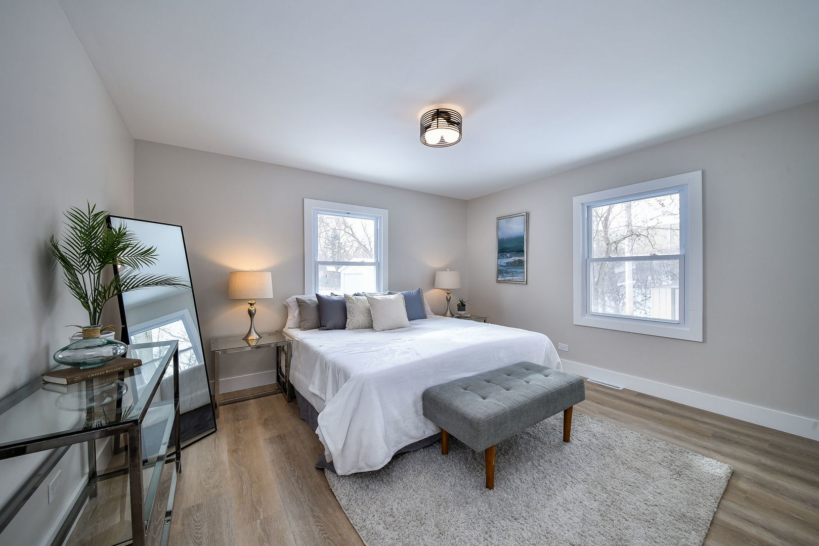 5740 Ridgewood Drive Western Springs, IL 60558 - Photo 16 of 25 a spacious bedroom with a bed and wooden floor