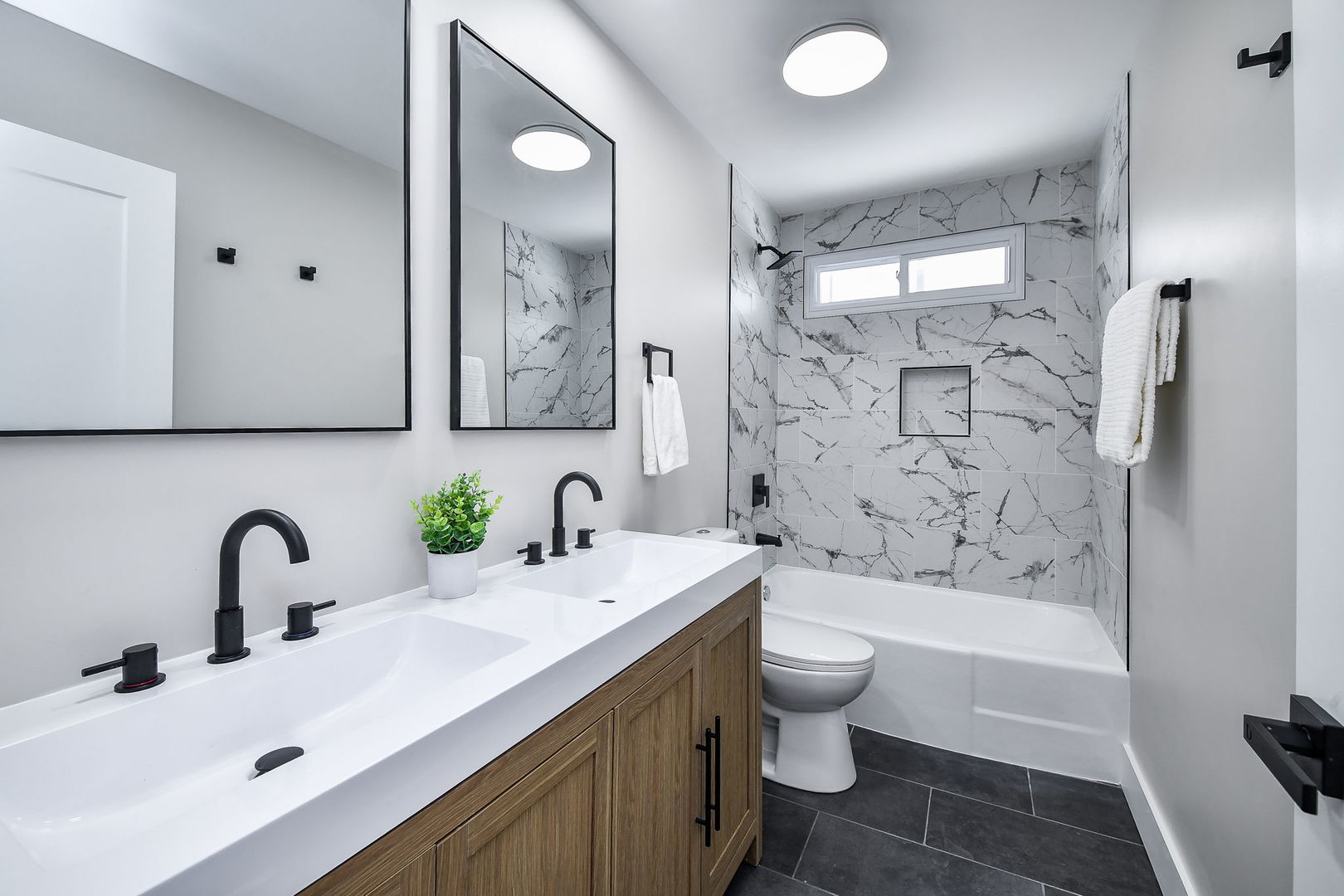 5740 Ridgewood Drive Western Springs, IL 60558 - Photo 20 of 25 a bathroom with a double vanity sink toilet and shower