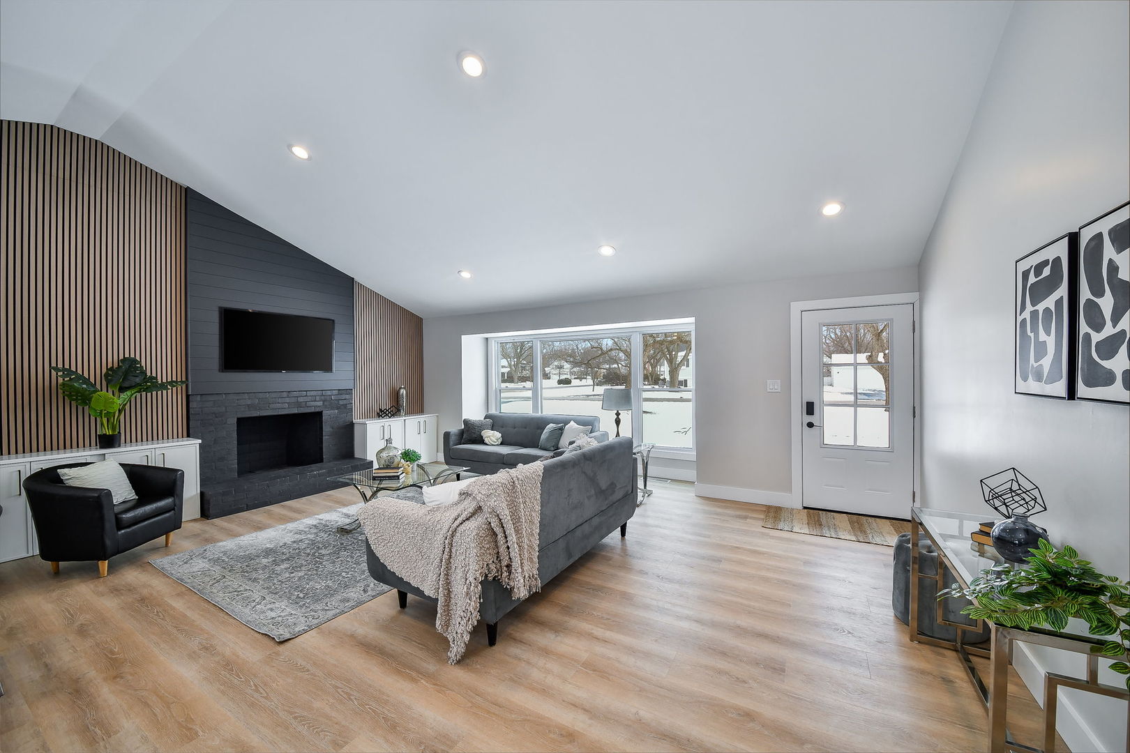 5740 Ridgewood Drive Western Springs, IL 60558 - Photo 3 of 25 a living room with furniture a fireplace and a flat screen tv
