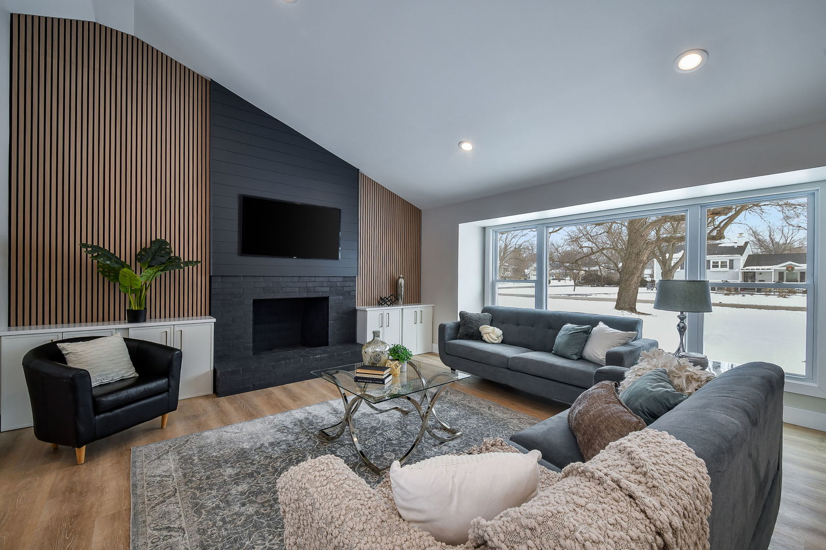 5740 Ridgewood Drive Western Springs, IL 60558 - Photo 4 of 25 a living room with furniture a fireplace and a large window
