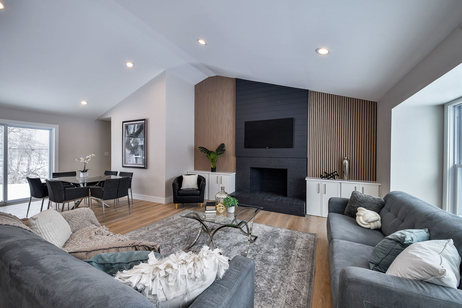 5740 Ridgewood Drive Western Springs, IL 60558 - Photo 5 of 25 a living room with furniture a fireplace and a flat screen tv