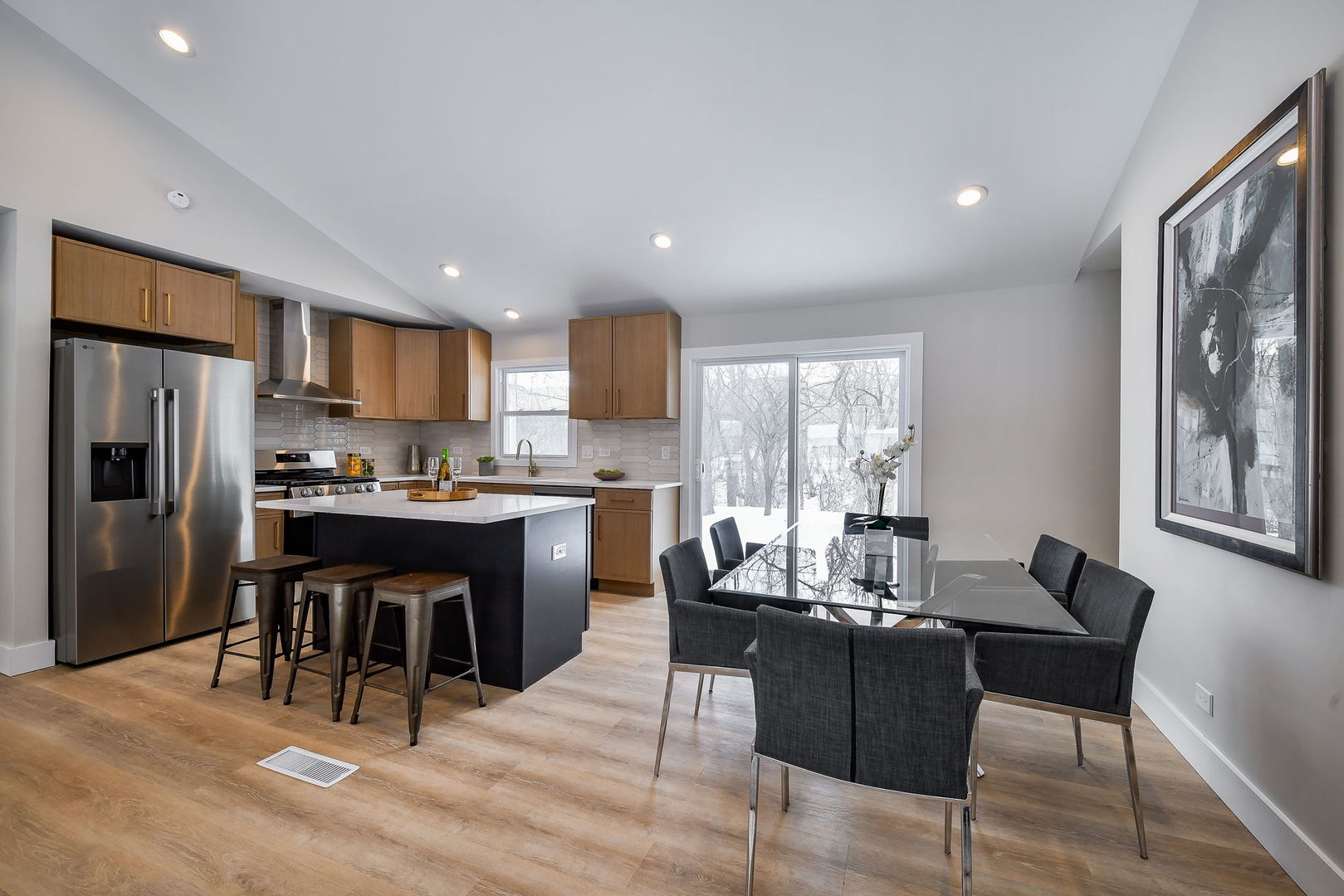 5740 Ridgewood Drive Western Springs, IL 60558 - Photo 8 of 25 a kitchen with a refrigerator and a dining table