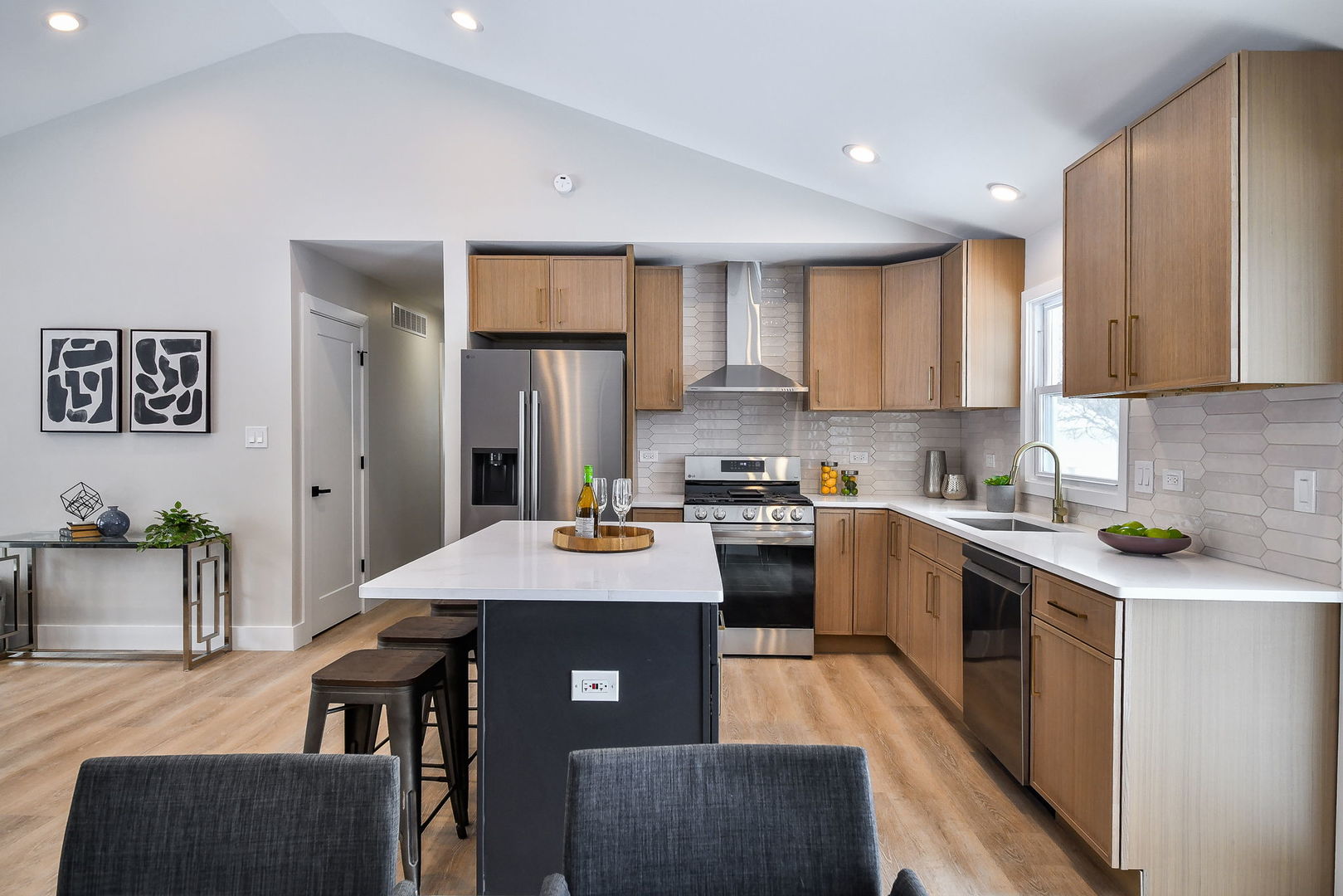 5740 Ridgewood Drive Western Springs, IL 60558 - Photo 10 of 25 a kitchen with a table chairs refrigerator and cabinets