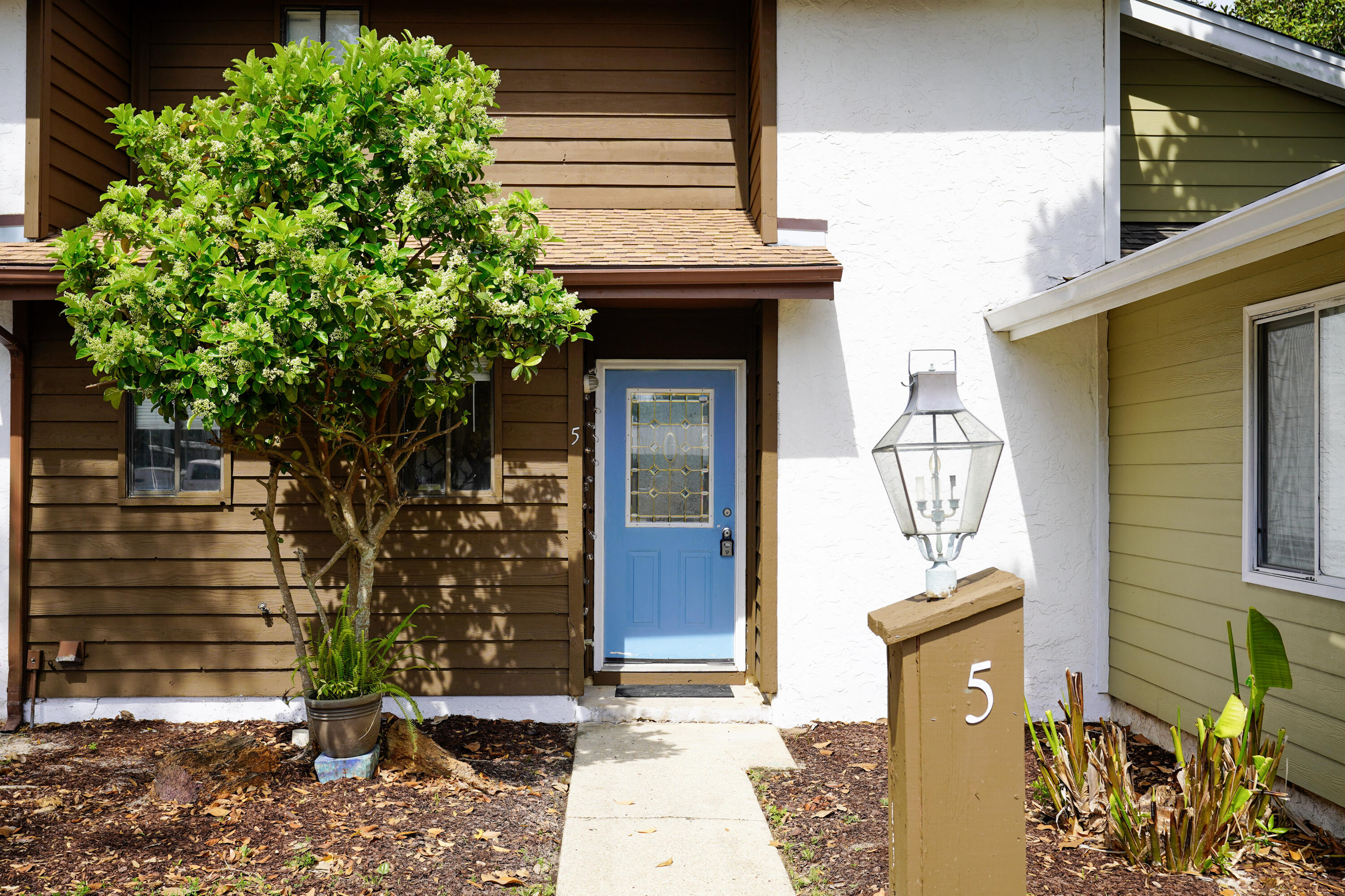 5 Pine Ridge Trace Destin, FL 32541 - Photo 1 of 22 a front view of a house with garden