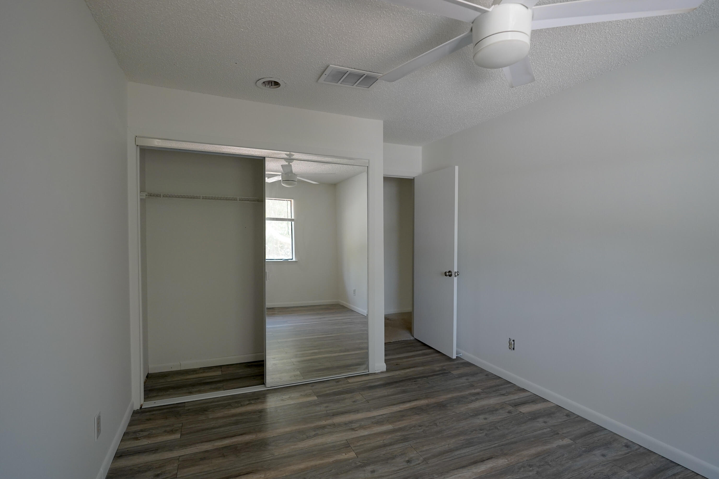 5 Pine Ridge Trace Destin, FL 32541 - Photo 14 of 22 a view of an empty room with wooden floor