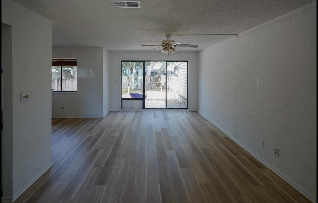 5 Pine Ridge Trace Destin, FL 32541 - Photo 6 of 22 wooden floor in an empty room with a window