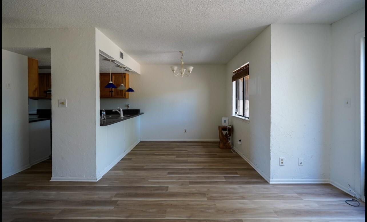 5 Pine Ridge Trace Destin, FL 32541 - Photo 7 of 22 a view of a hallway with wooden floor and closet