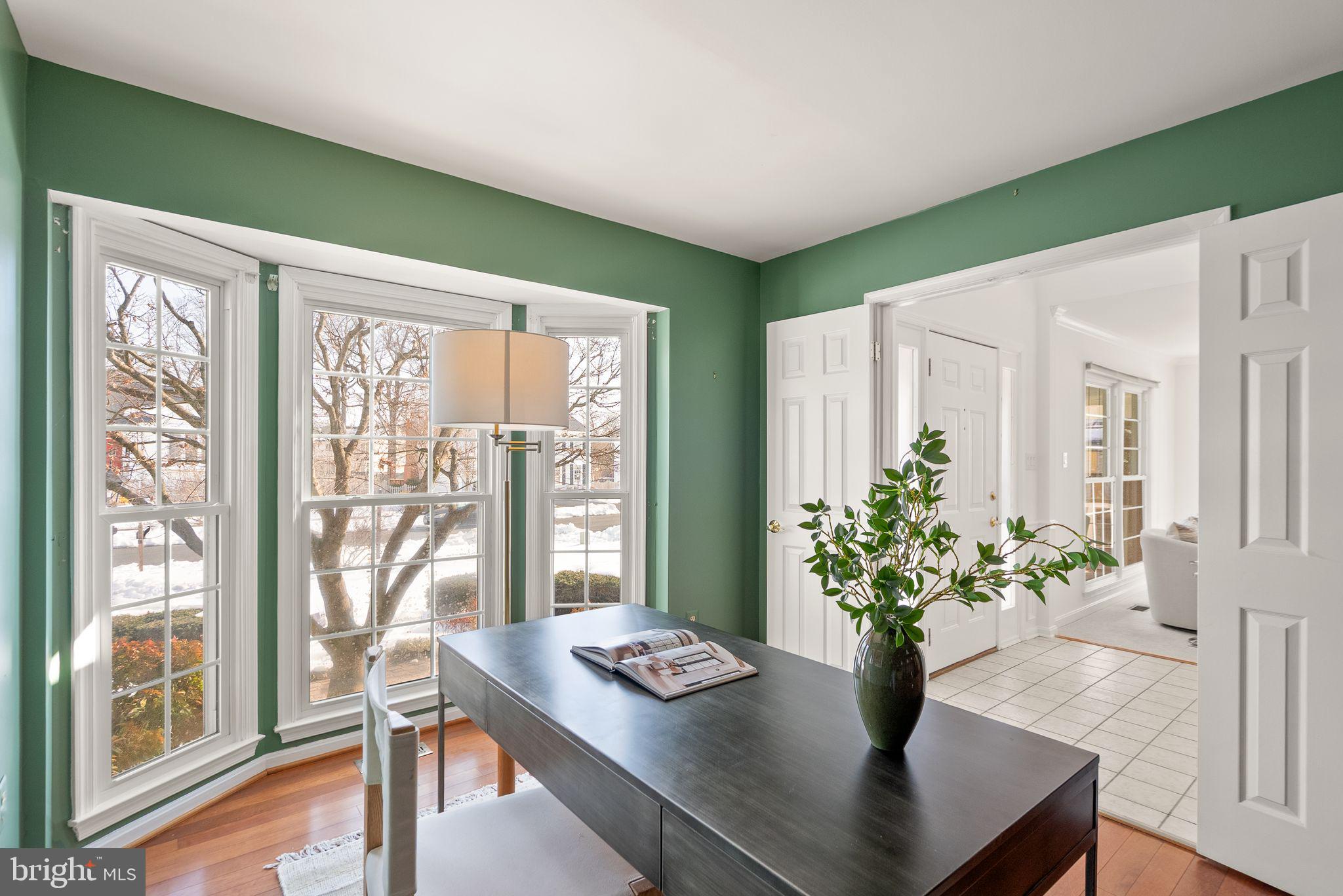 8144 Tall Timber Drive Gainesville, VA 20155 - Photo 13 of 73 a view of a dining room with furniture window and wooden floor