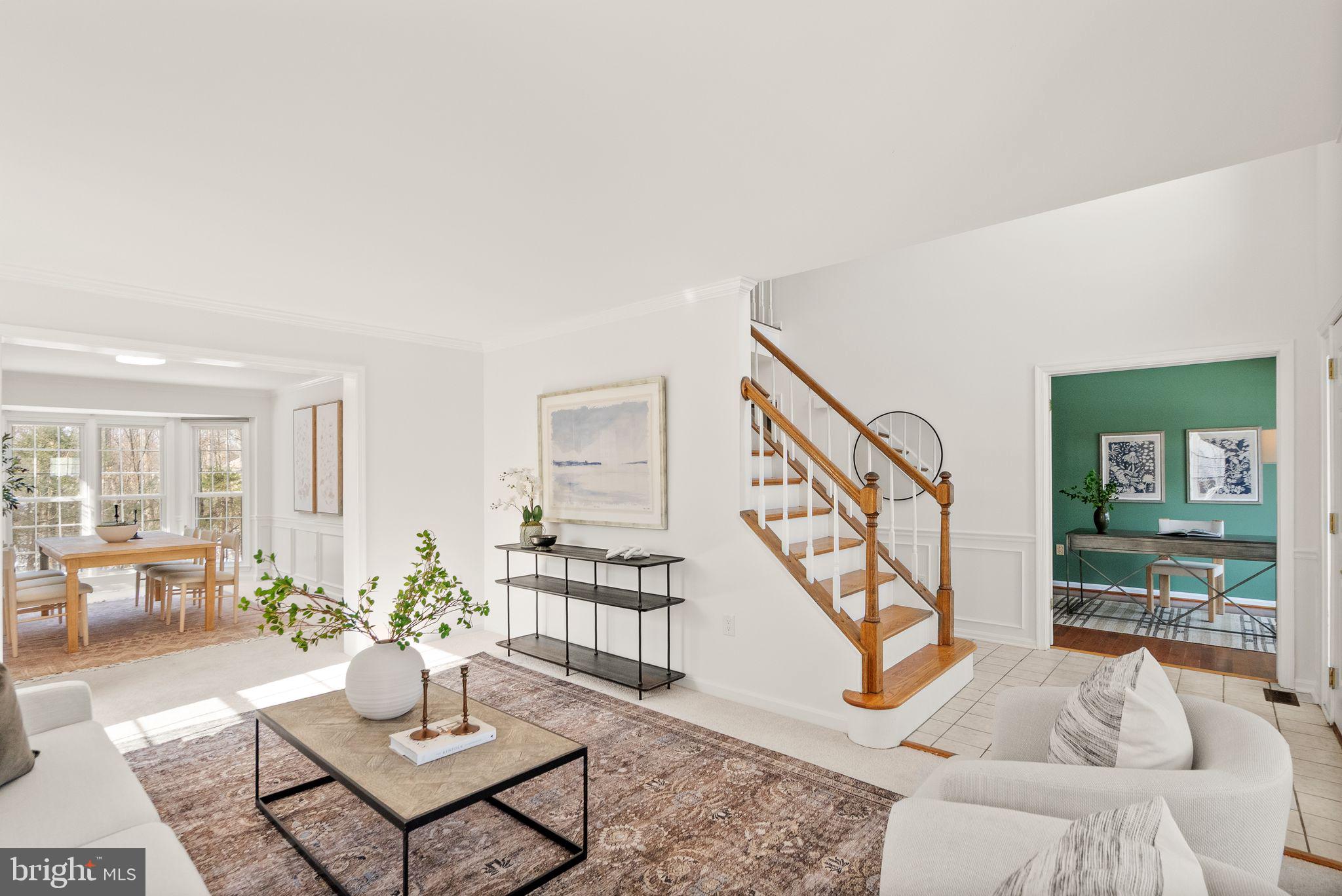8144 Tall Timber Drive Gainesville, VA 20155 - Photo 14 of 73 a living room with furniture and a table