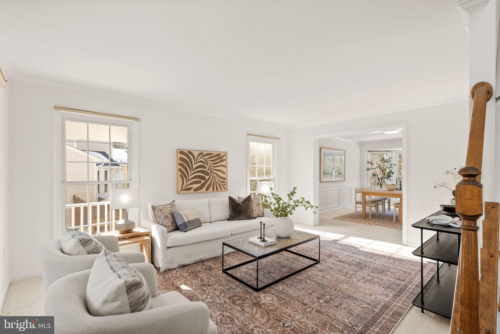 8144 Tall Timber Drive Gainesville, VA 20155 - Photo 15 of 73 a living room with furniture a rug and a flat screen tv