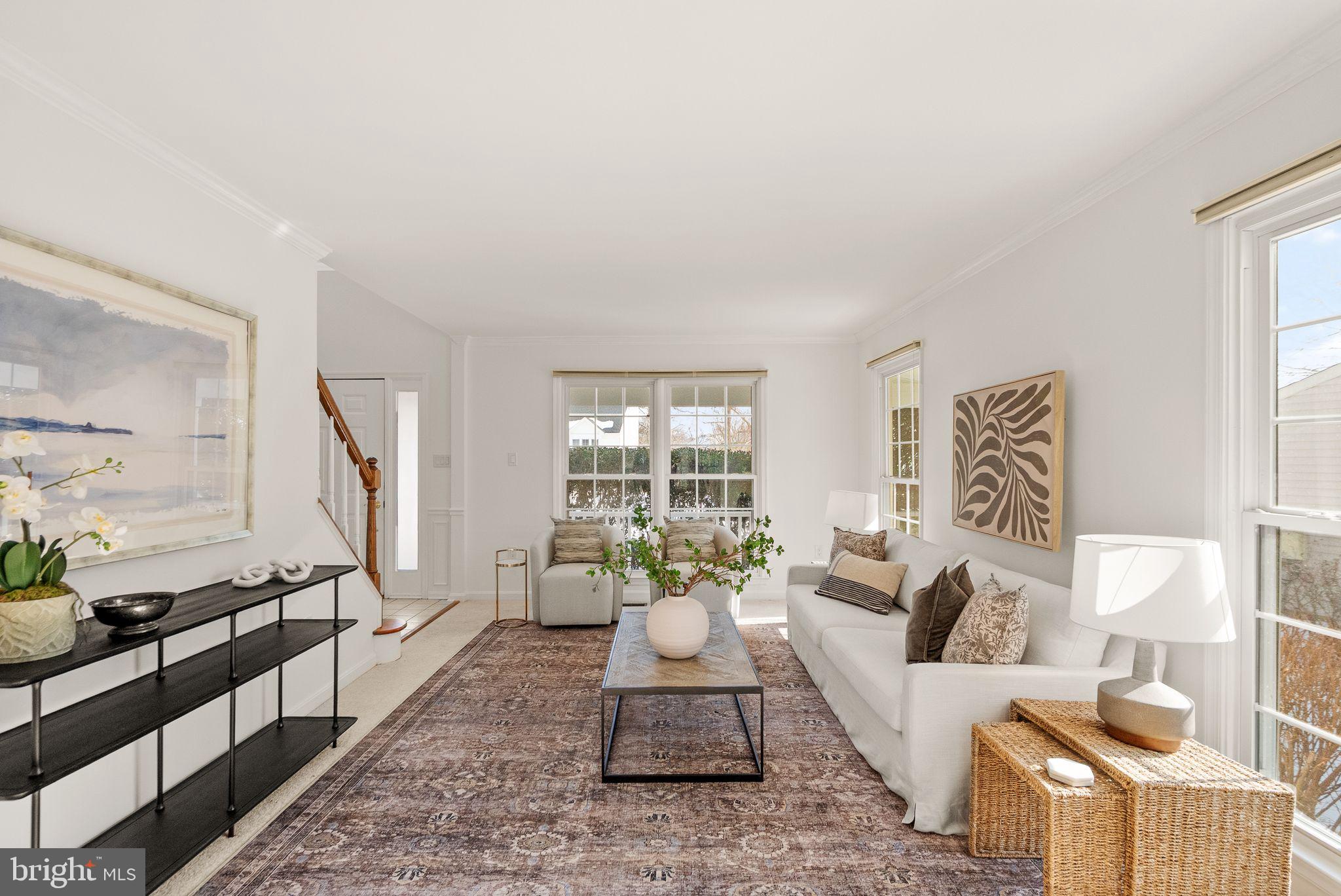 8144 Tall Timber Drive Gainesville, VA 20155 - Photo 16 of 73 a living room with furniture and a large window