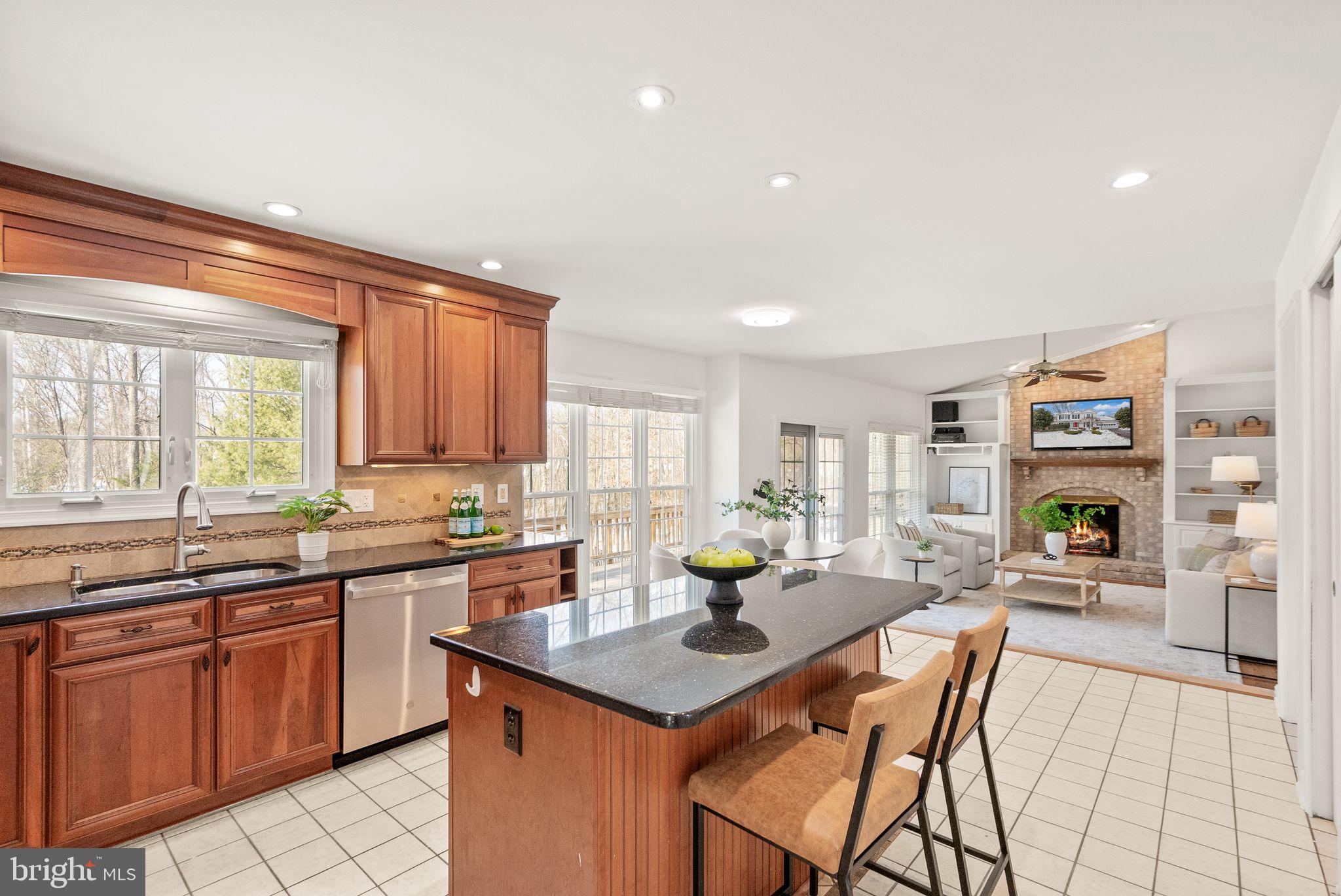 8144 Tall Timber Drive Gainesville, VA 20155 - Photo 22 of 73 a kitchen with a sink and cabinets
