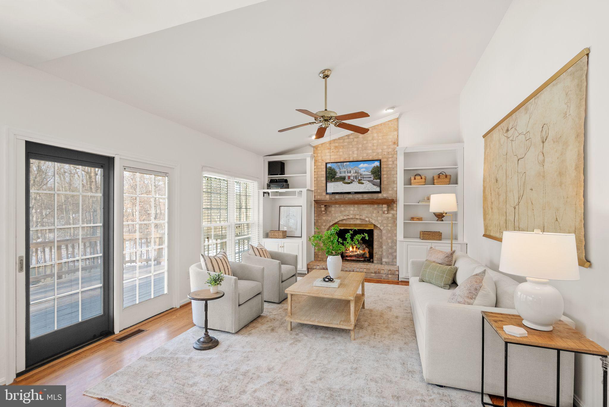 8144 Tall Timber Drive Gainesville, VA 20155 - Photo 26 of 73 a living room with furniture and a fireplace