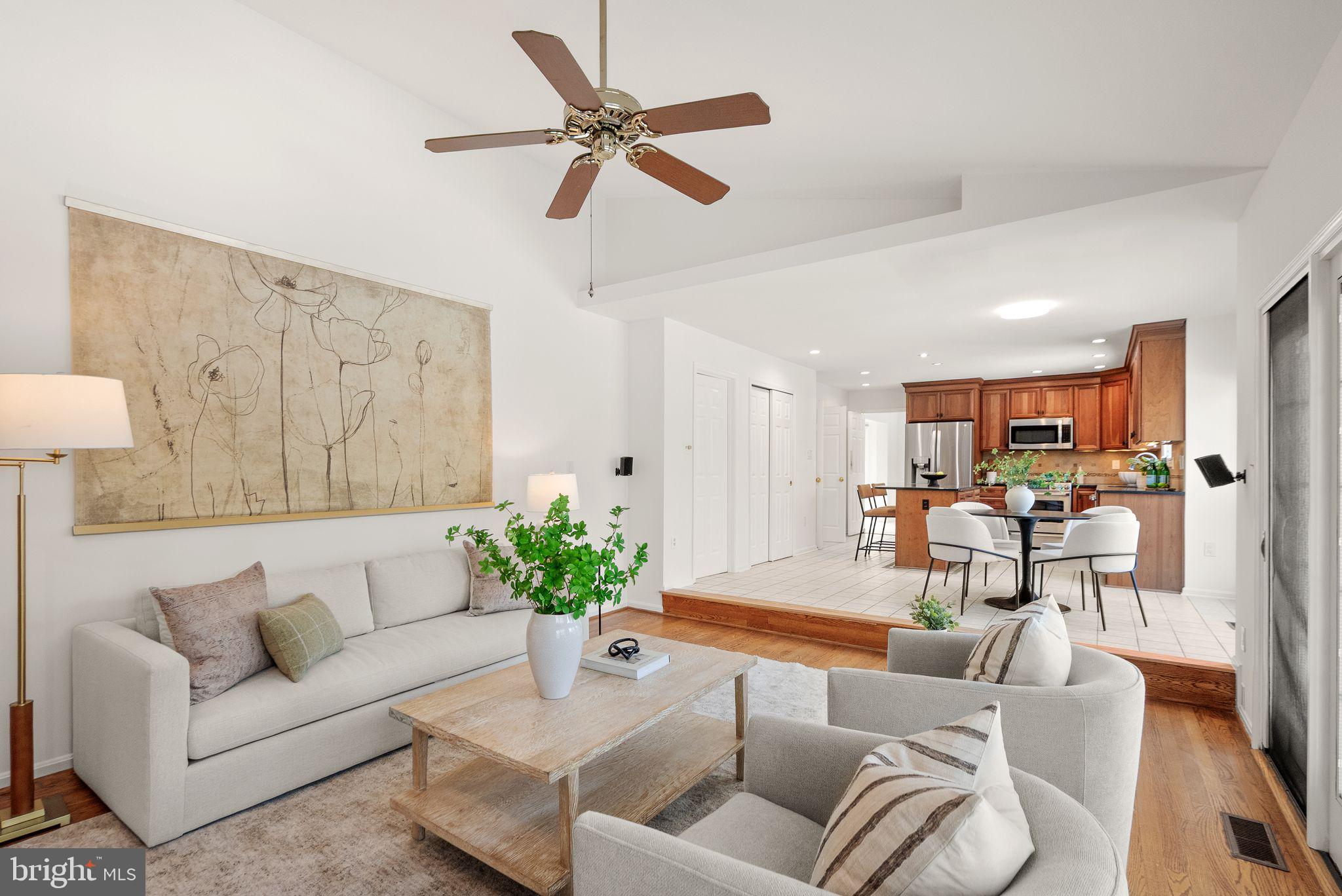 8144 Tall Timber Drive Gainesville, VA 20155 - Photo 28 of 73 a living room with furniture kitchen view and a chandelier