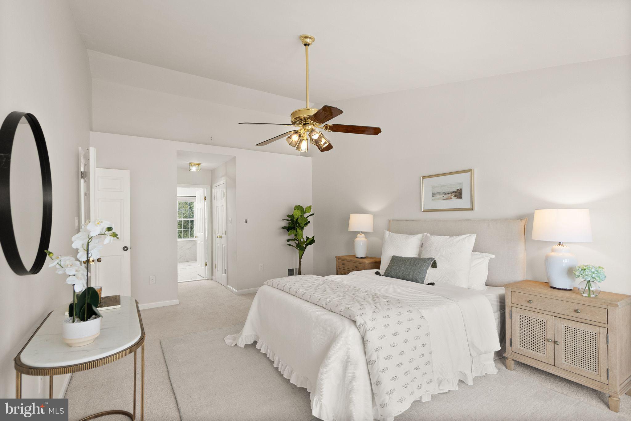 8144 Tall Timber Drive Gainesville, VA 20155 - Photo 32 of 73 a bedroom with a bed and a chandelier
