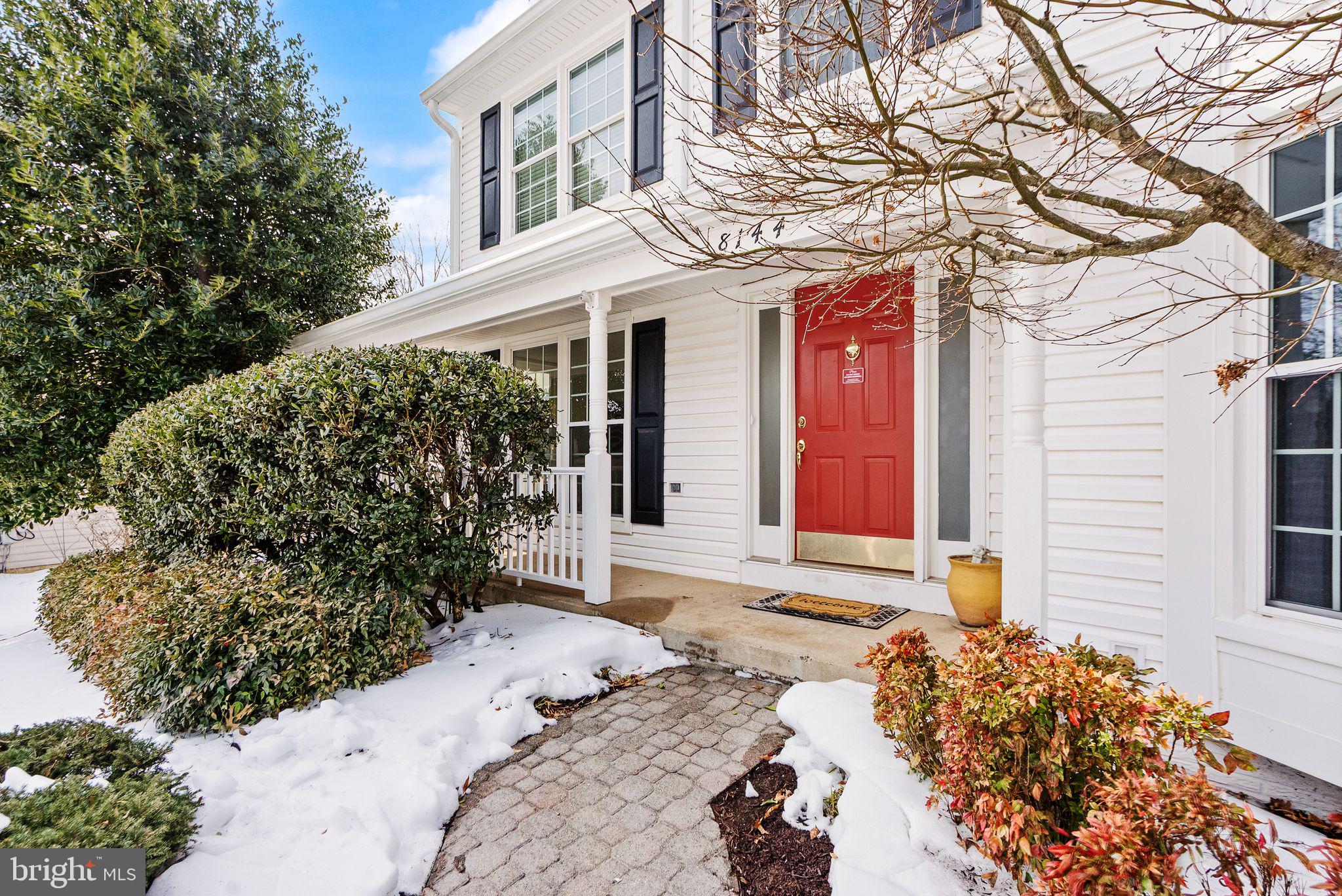 8144 Tall Timber Drive Gainesville, VA 20155 - Photo 4 of 73 a front view of a house with a yard