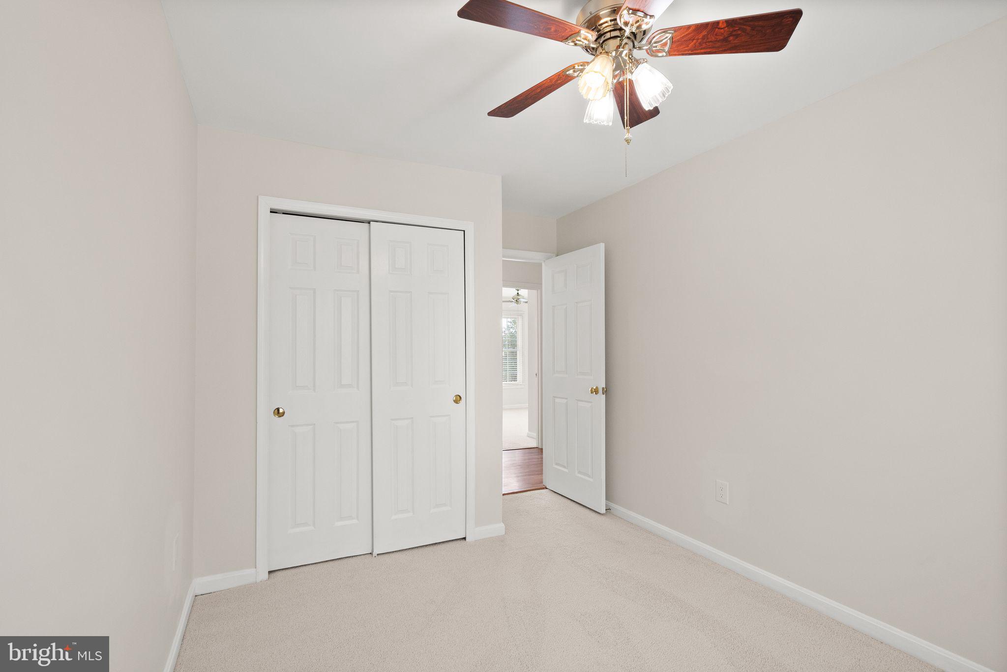 8144 Tall Timber Drive Gainesville, VA 20155 - Photo 42 of 73 an empty room with windows and fan