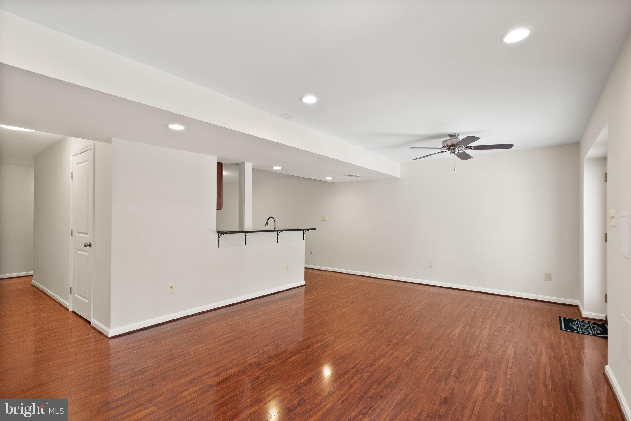 8144 Tall Timber Drive Gainesville, VA 20155 - Photo 50 of 73 wooden floor in an empty room with a window