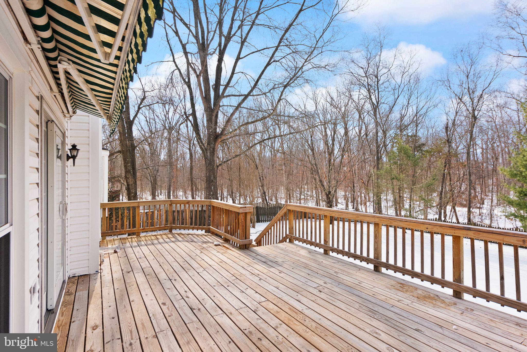 8144 Tall Timber Drive Gainesville, VA 20155 - Photo 56 of 73 a view of a wooden deck with a yard