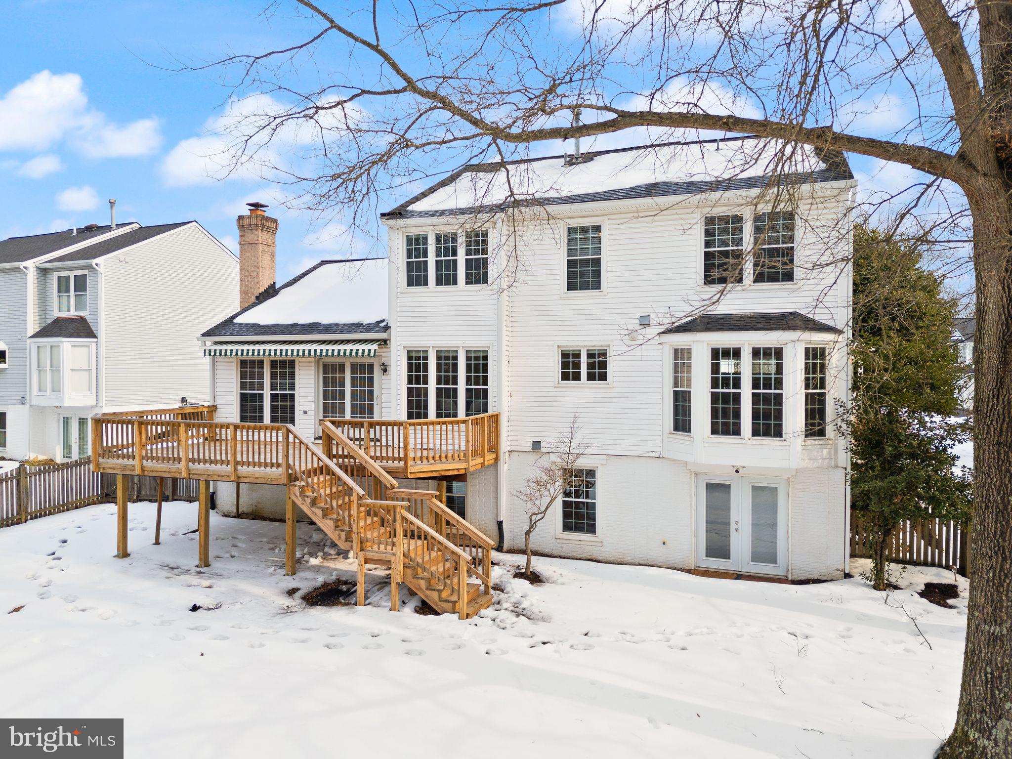 8144 Tall Timber Drive Gainesville, VA 20155 - Photo 60 of 73 a view of a building with outdoor seating