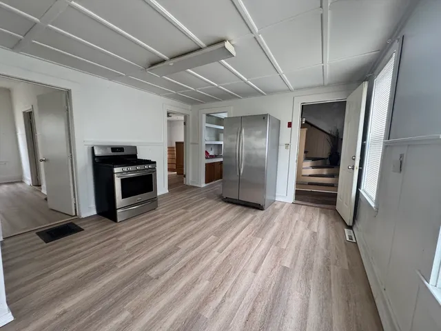 a view of a livingroom with wooden floor