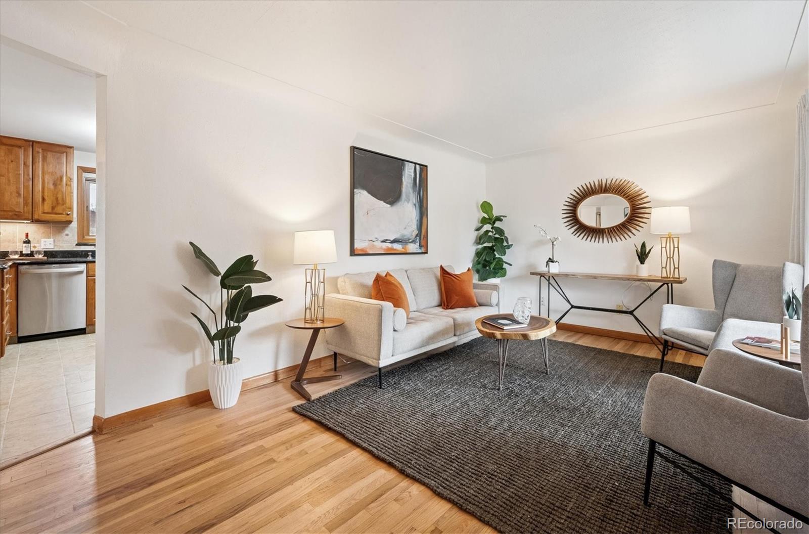 3880 Balsam Street Wheat Ridge, CO 80033 - Photo 12 of 40 a living room with furniture and a flat screen tv
