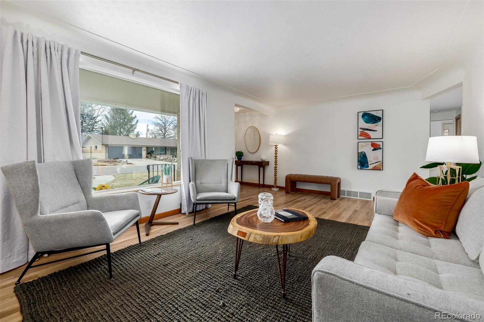 3880 Balsam Street Wheat Ridge, CO 80033 - Photo 13 of 40 a living room with furniture and a table