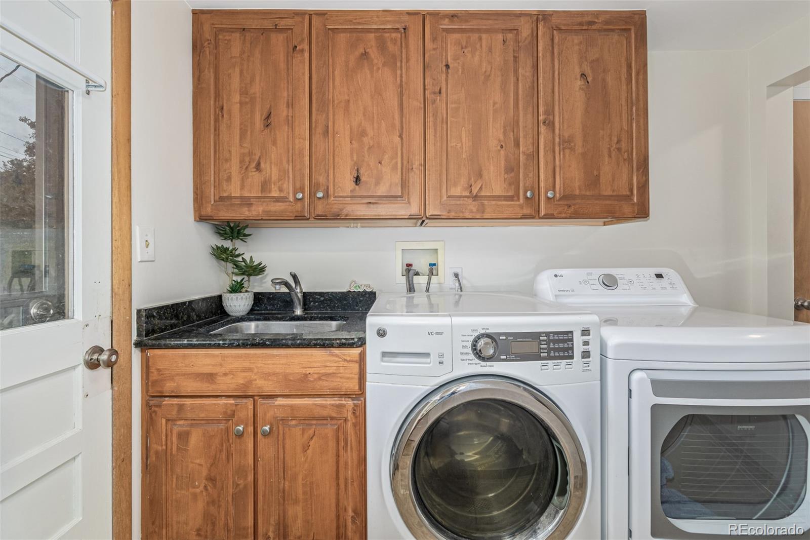 3880 Balsam Street Wheat Ridge, CO 80033 - Photo 26 of 40 a utility room with dryer and washer
