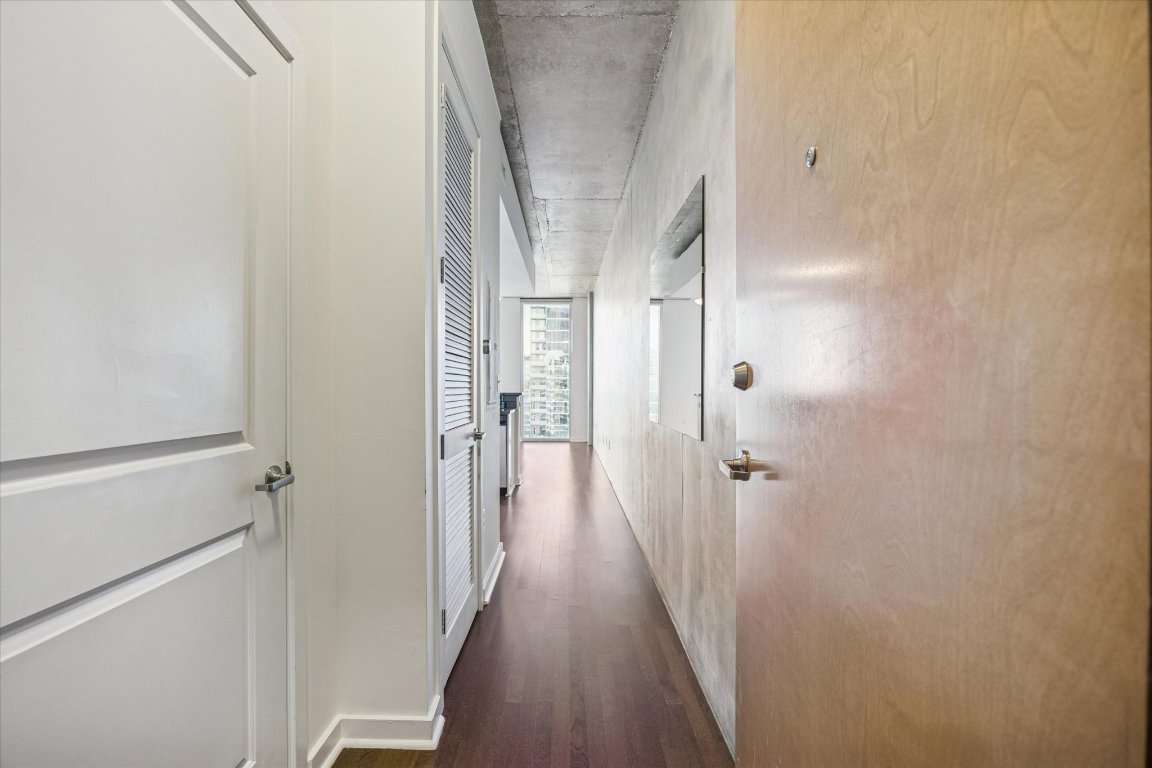 360 Nueces Street, Unit 4008 Austin, TX 78701 - Photo 24 of 40 a view of a hallway with wooden floor and staircase