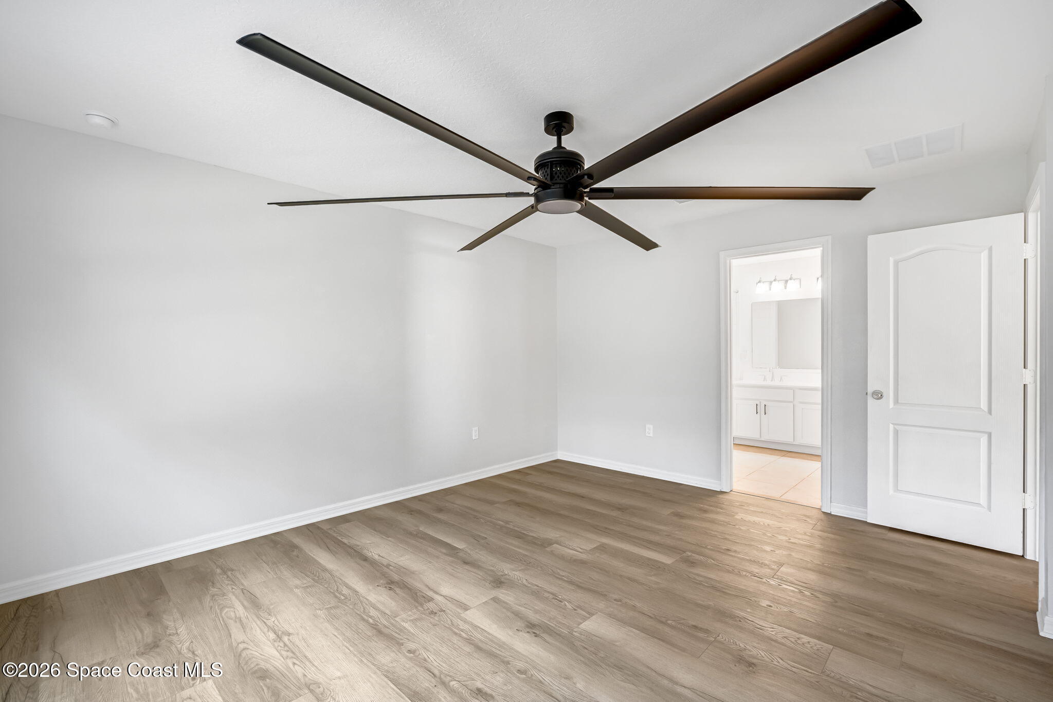 1219 Moscato Drive Titusville, FL 32780 - Photo 11 of 21 a view of a big room with wooden floor