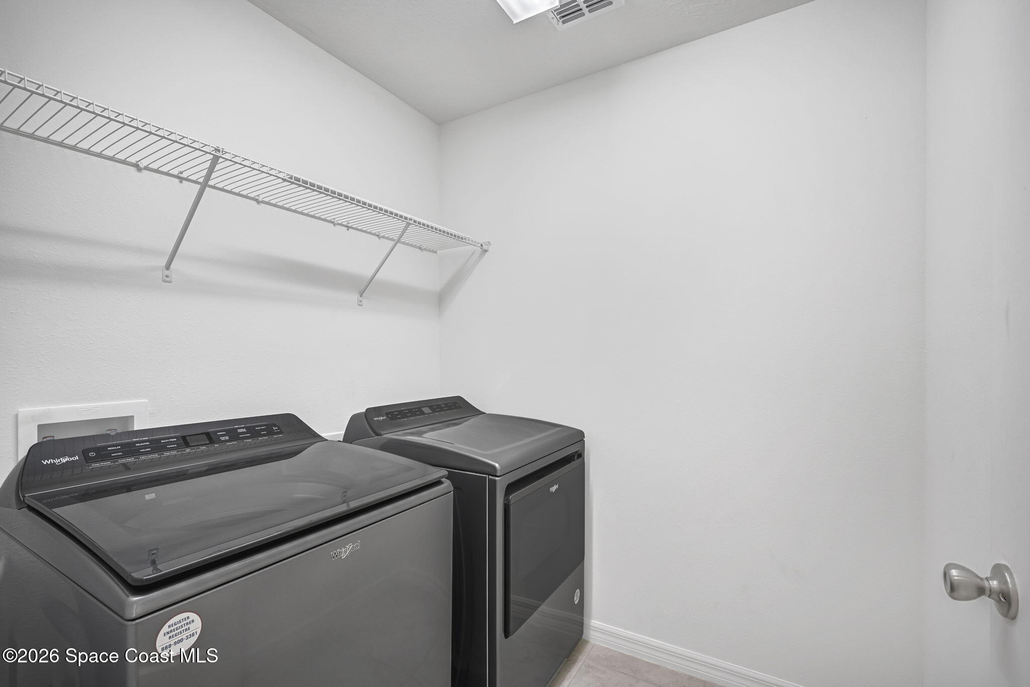 1219 Moscato Drive Titusville, FL 32780 - Photo 17 of 21 a utility room with dryer and washer