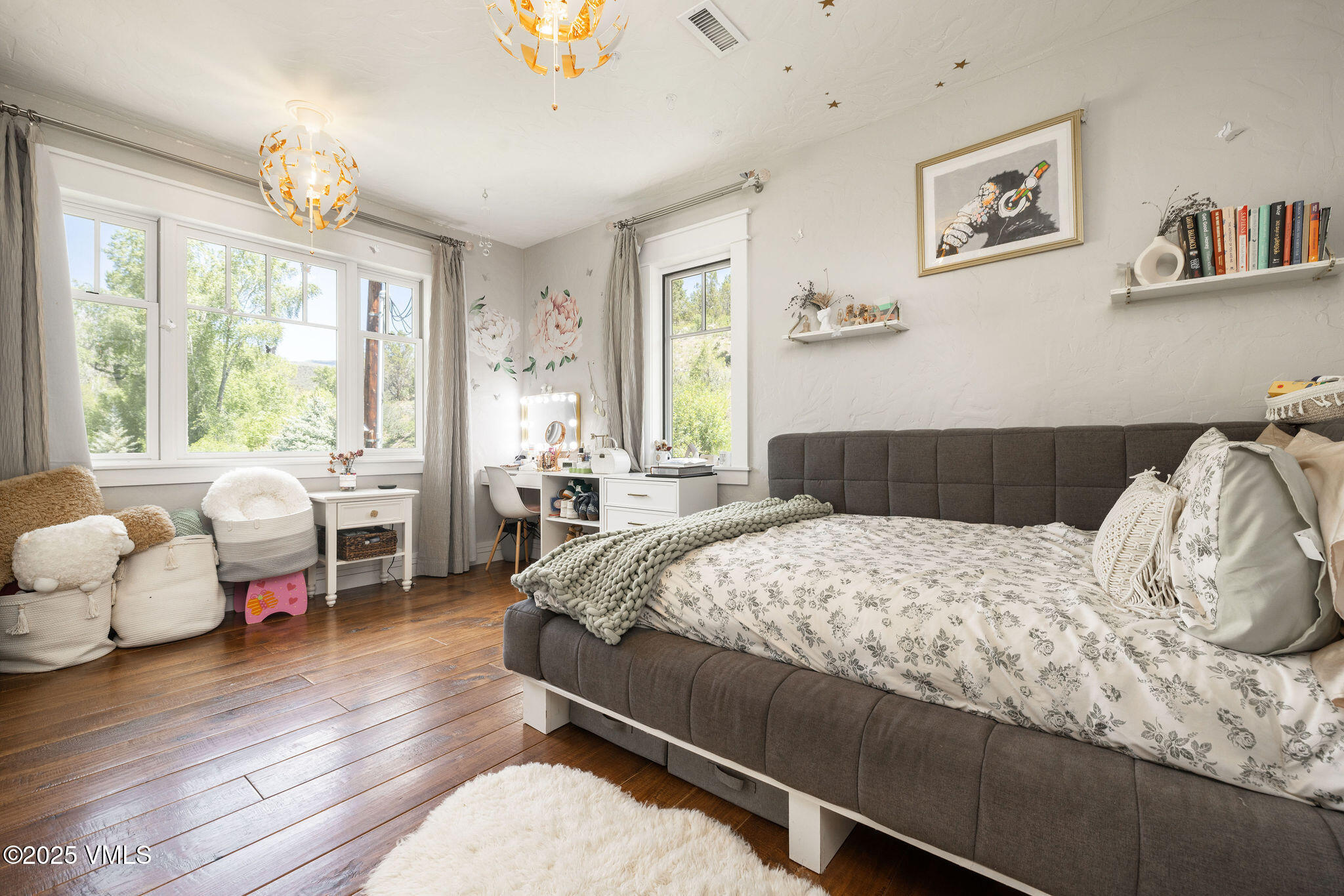 1794 Eby Creek Road Eagle, CO 81631 - Photo 14 of 45 a bedroom with a bed and wooden floor