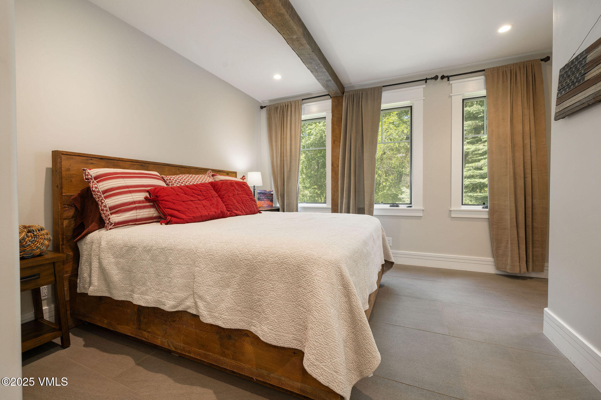 1794 Eby Creek Road Eagle, CO 81631 - Photo 15 of 45 a bedroom with a large bed and a large window