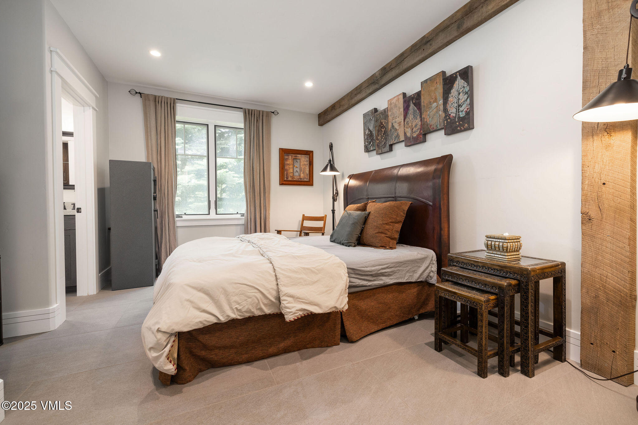 1794 Eby Creek Road Eagle, CO 81631 - Photo 16 of 45 a bedroom with a bed and a night stand