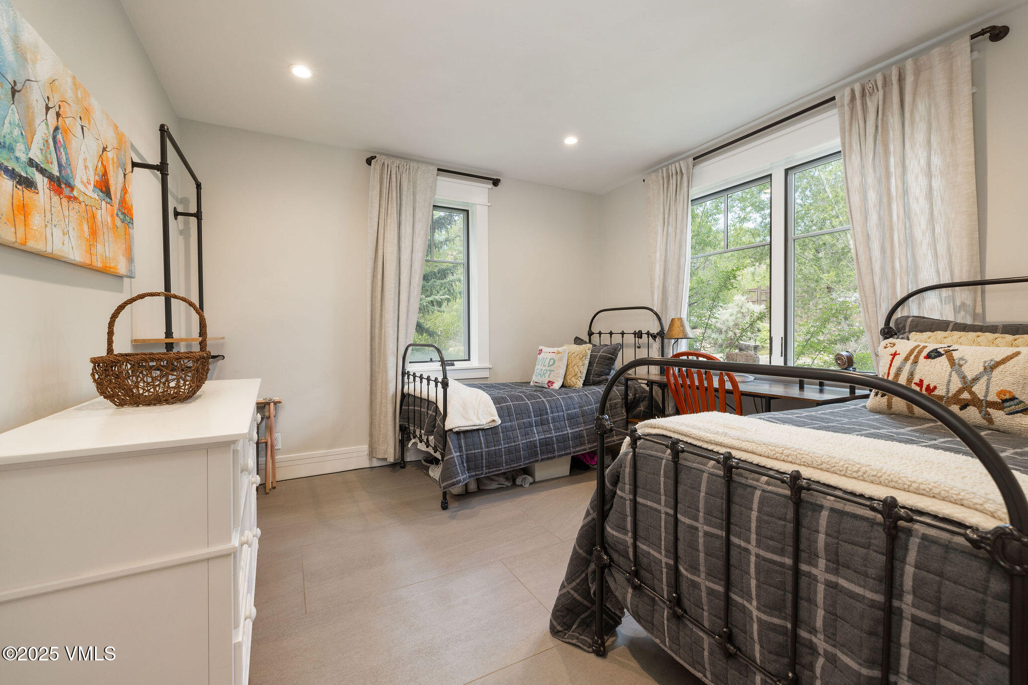 1794 Eby Creek Road Eagle, CO 81631 - Photo 17 of 45 a bedroom with two beds and a window