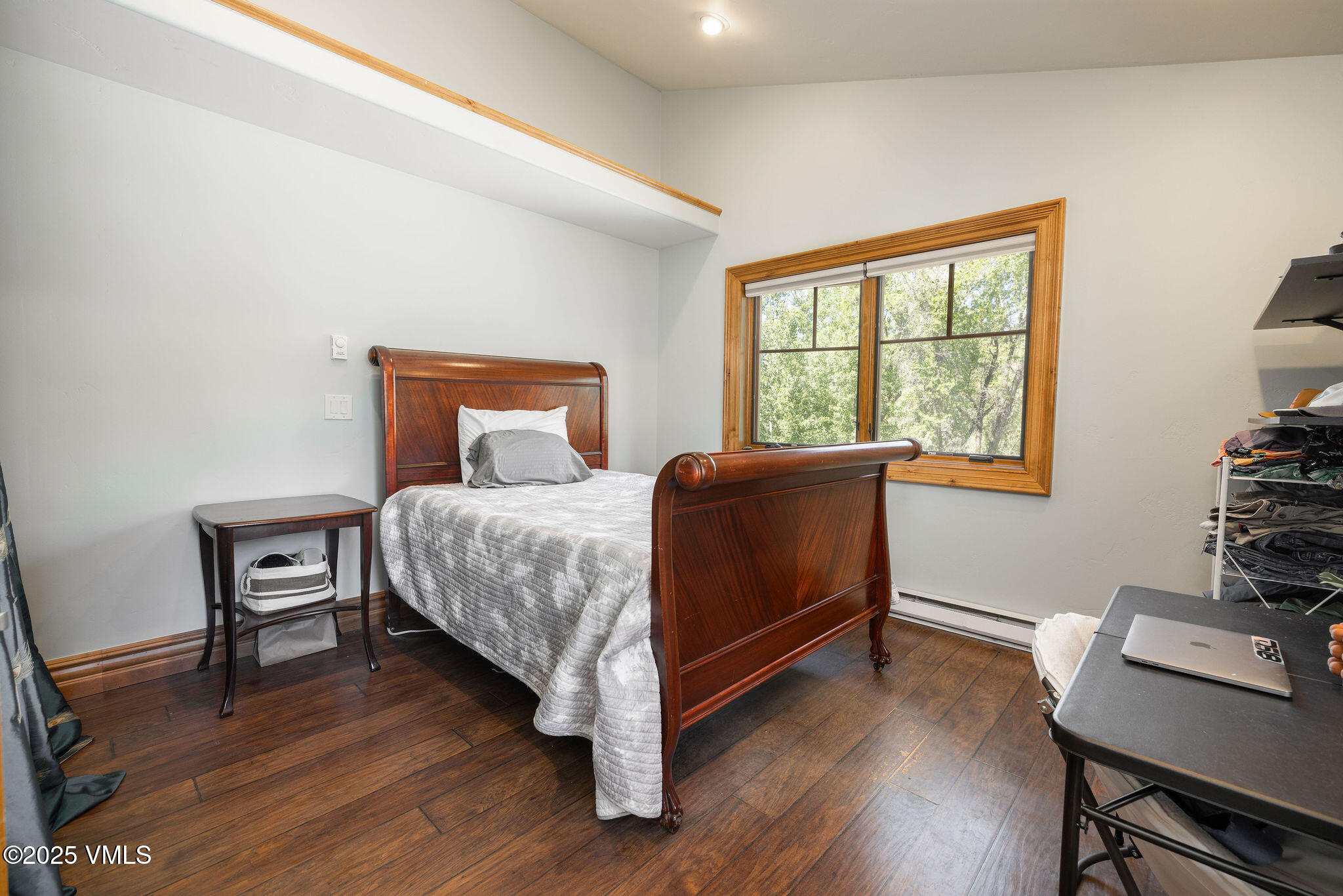 1794 Eby Creek Road Eagle, CO 81631 - Photo 19 of 45 a bedroom with a bed and a window