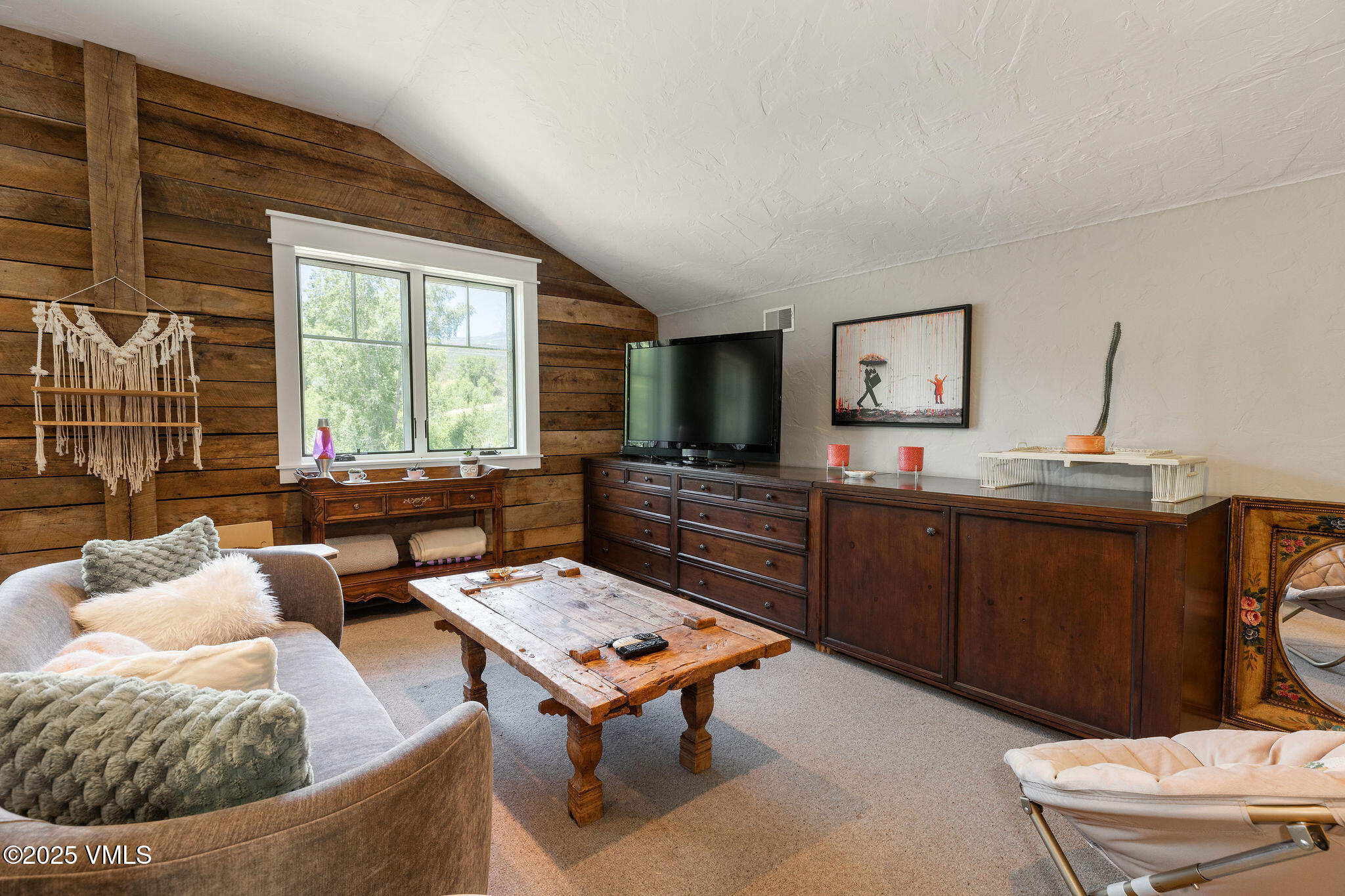 1794 Eby Creek Road Eagle, CO 81631 - Photo 23 of 45 a living room with furniture and a flat screen tv