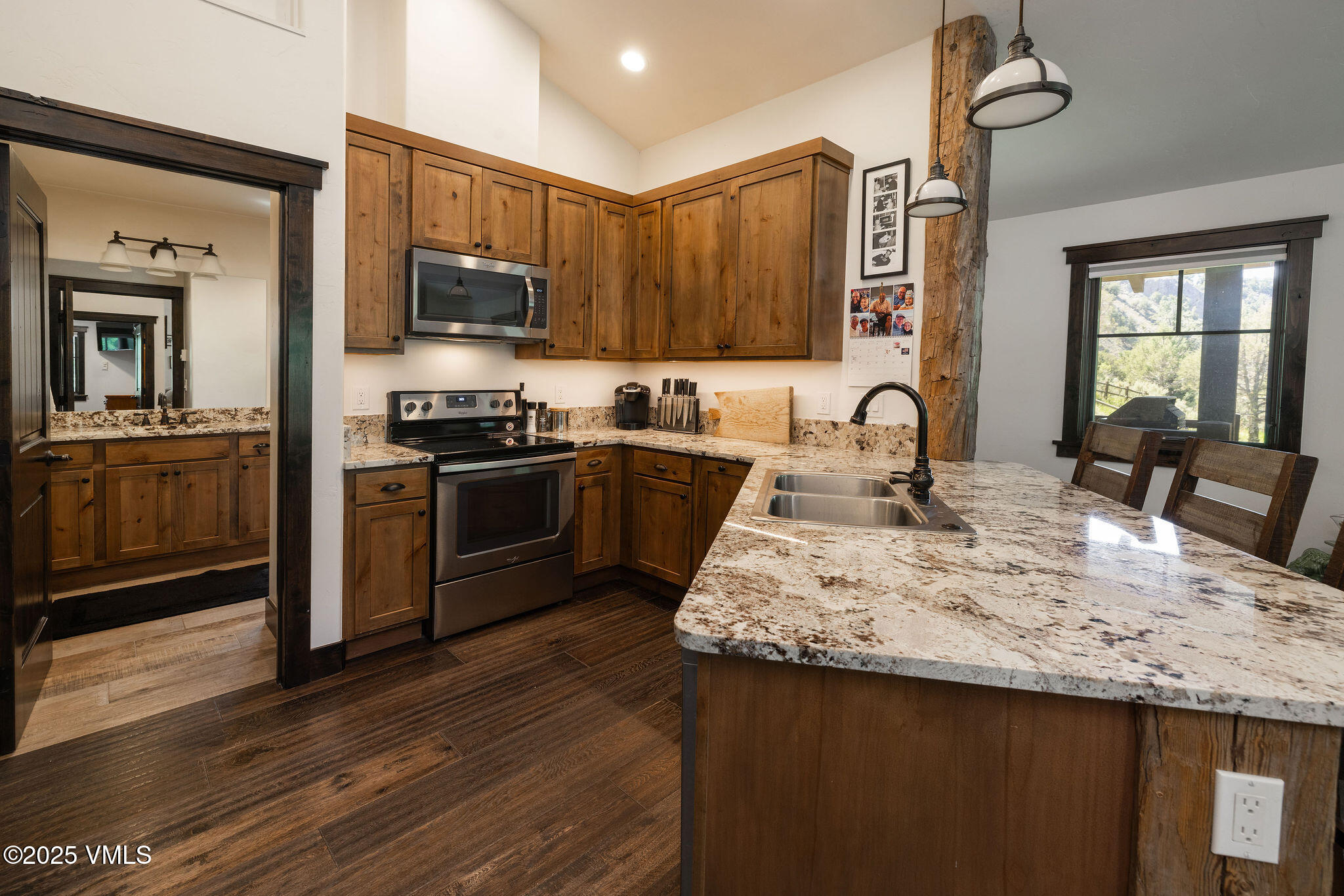 1794 Eby Creek Road Eagle, CO 81631 - Photo 25 of 45 a kitchen with stainless steel appliances granite countertop a sink stove and refrigerator
