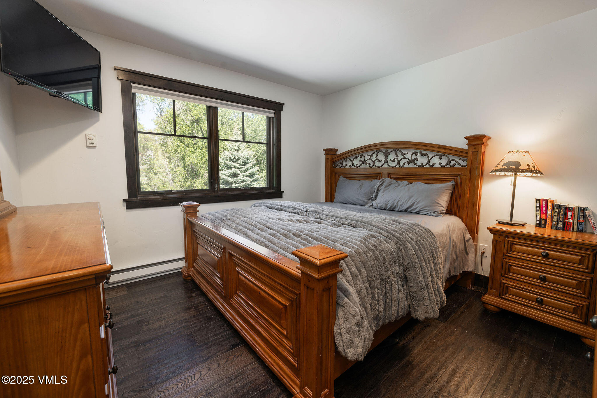 1794 Eby Creek Road Eagle, CO 81631 - Photo 27 of 45 a bed sitting in a bedroom next to a window