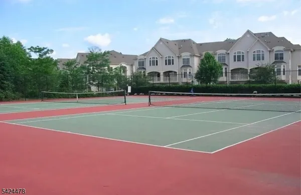a view of an outdoor space and tennis court
