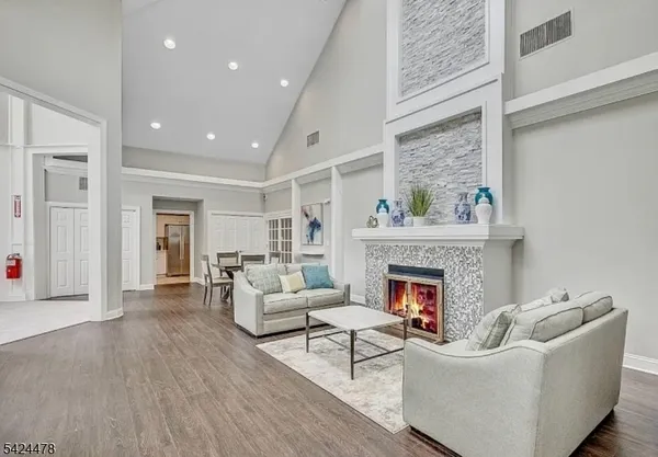 a living room with furniture and a fireplace