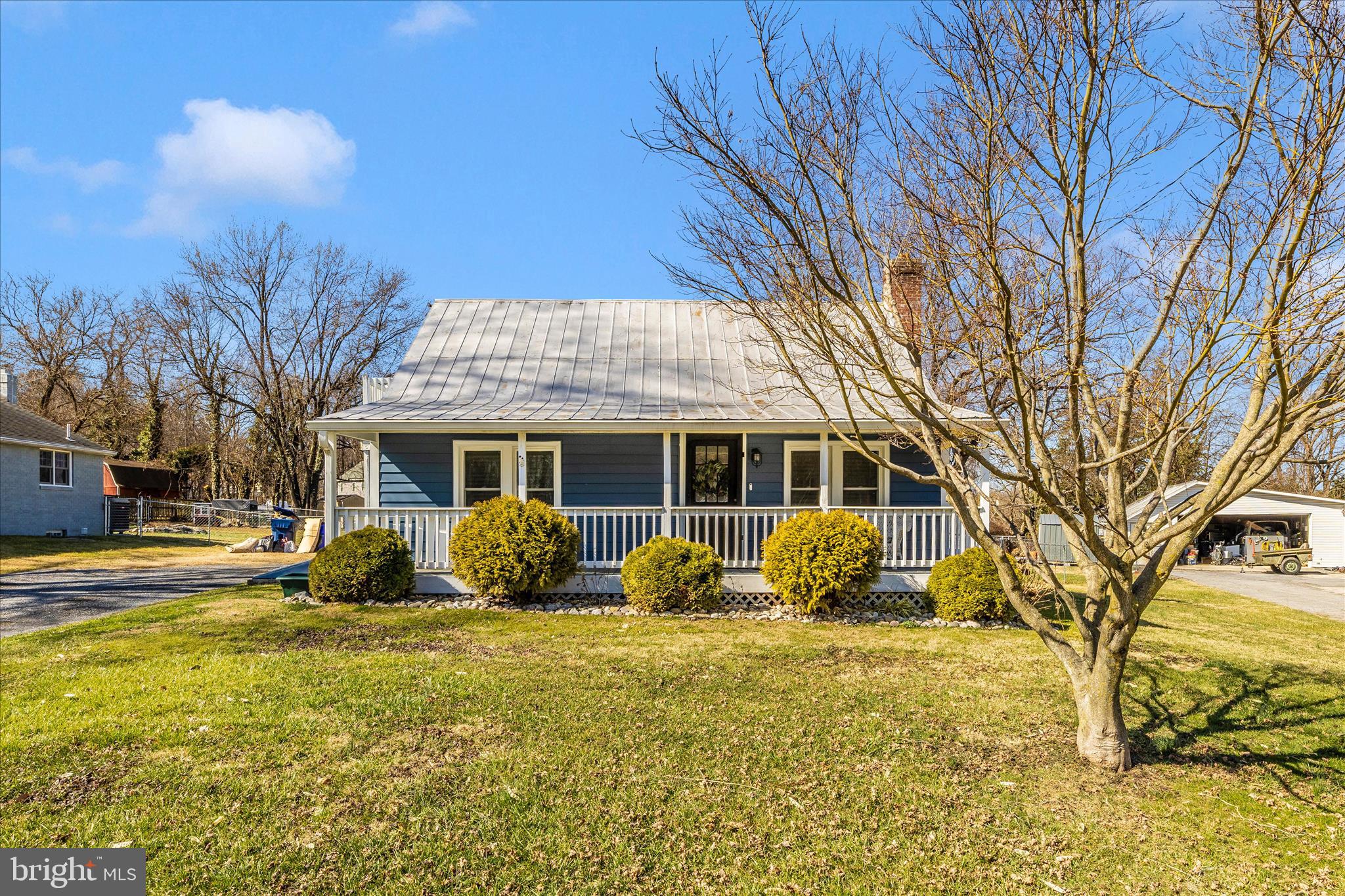 5618 Bartonsville Road Frederick, MD 21704 - Photo 1 of 53 a front view of a house with a yard