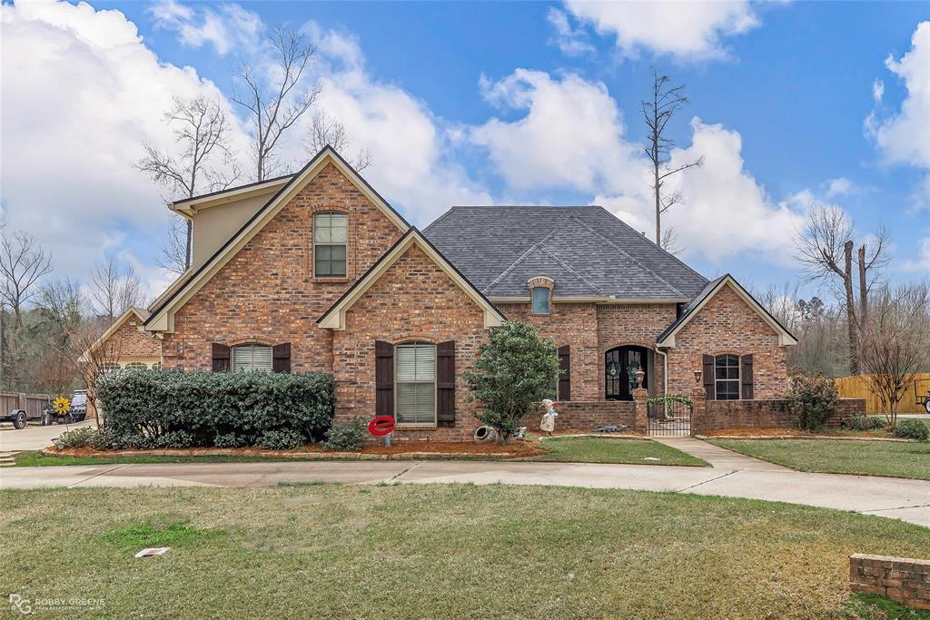 2820 Sunrise Point Haughton, LA 71037 - Photo 1 of 1 a front view of a house with a yard
