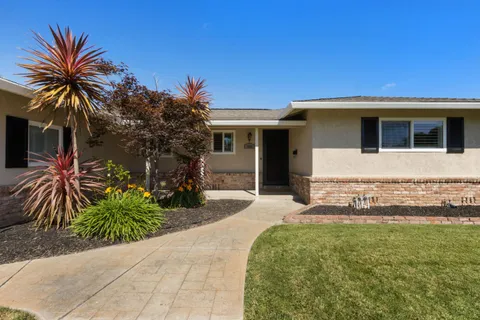 a front view of house with yard and seating space