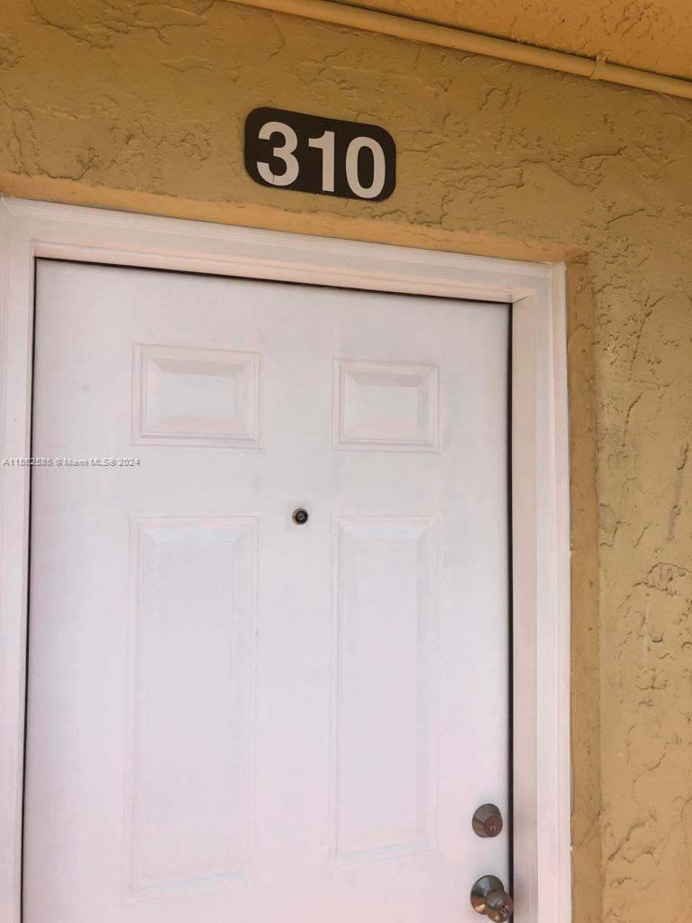 9273 Southwest 8th Street, Unit 310 Boca Raton, FL 33428 - Photo 18 of 21 a close up of a sign