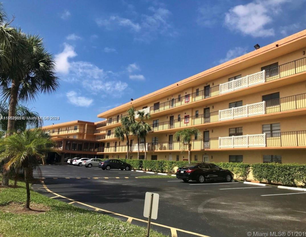 9273 Southwest 8th Street, Unit 310 Boca Raton, FL 33428 - Photo 21 of 21 a front view of a building with street view