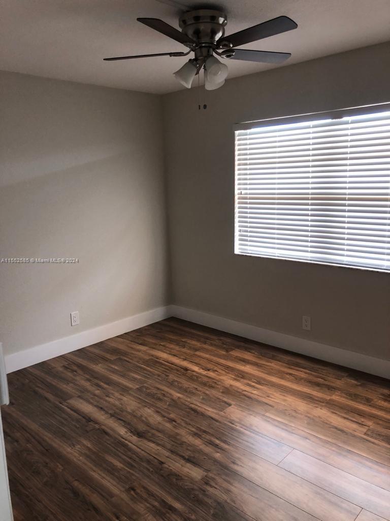 9273 Southwest 8th Street, Unit 310 Boca Raton, FL 33428 - Photo 6 of 21 a view of an empty room with a window
