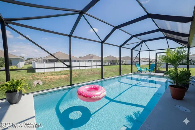 a view of a swimming pool with a lounge chairs