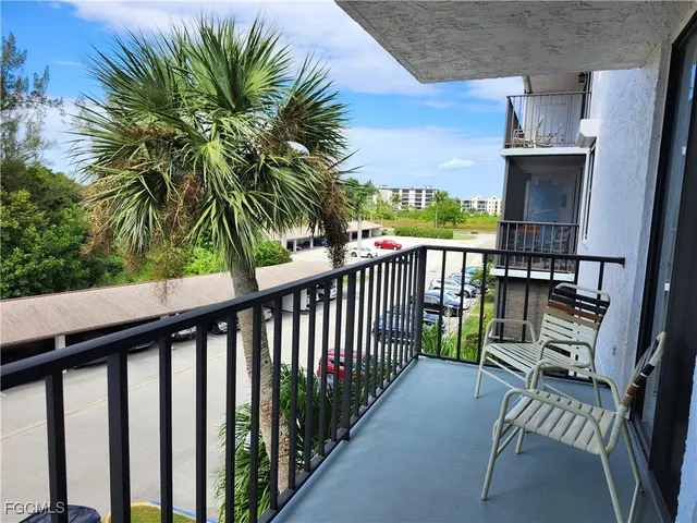 a view of balcony with furniture